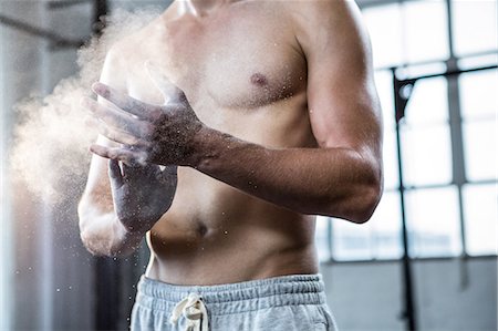 strong human physical strength - Fit shirtless man chalking his hands Stock Photo - Premium Royalty-Free, Code: 6109-08398083