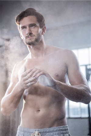 simsearch:6109-08398035,k - Fit shirtless man chalking his hands Stock Photo - Premium Royalty-Free, Code: 6109-08398080