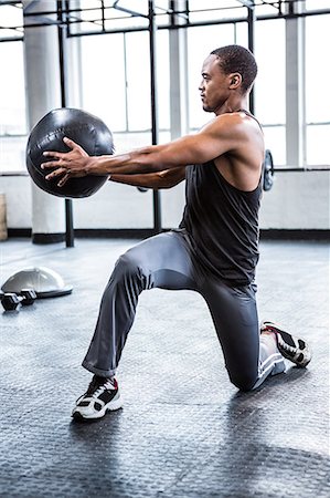 simsearch:6109-08398105,k - Fit man working out with ball Stock Photo - Premium Royalty-Free, Code: 6109-08398094