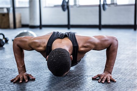 simsearch:6109-08398105,k - Fit man working out in studio Stock Photo - Premium Royalty-Free, Code: 6109-08398099