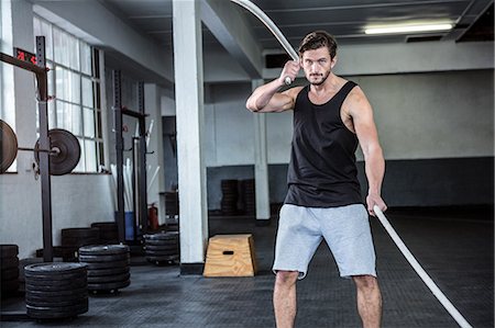 simsearch:6109-08398105,k - Fit man working out with battle ropes Stock Photo - Premium Royalty-Free, Code: 6109-08398025