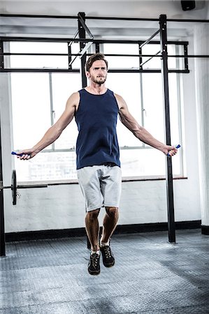 fit body - Fit man with skipping rope Stock Photo - Premium Royalty-Free, Code: 6109-08398035