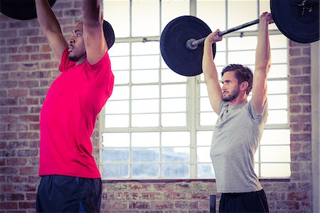 Fit people lifting barbell weight Stock Photo - Premium Royalty-Free, Code: 6109-08398166