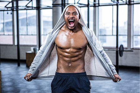 Fit shirtless man shouting at camera Stockbilder - Premium RF Lizenzfrei, Bildnummer: 6109-08398129