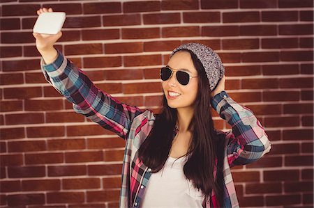 simsearch:6109-08398200,k - Attractive hipster taking selfie with her smartphone Stock Photo - Premium Royalty-Free, Code: 6109-08398245