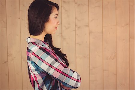 side plank pose - Young attractive hipster posing for camera Stock Photo - Premium Royalty-Free, Code: 6109-08398280