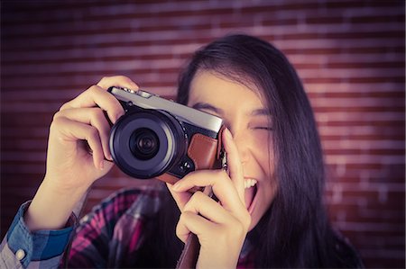 snapping fingers - Attractive hipster photographing with camera Stock Photo - Premium Royalty-Free, Code: 6109-08398219
