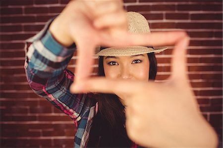 simsearch:6109-08398200,k - Attractive hipster taking picture with hands Stock Photo - Premium Royalty-Free, Code: 6109-08398236