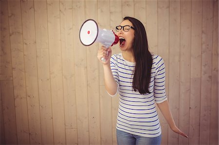 shout adult - Beautiful woman shouting with megaphone Stock Photo - Premium Royalty-Free, Code: 6109-08398344