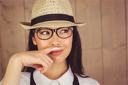 Hipster with mustache on finger Stock Photo - Premium Royalty-Free, Code: 6109-08398320