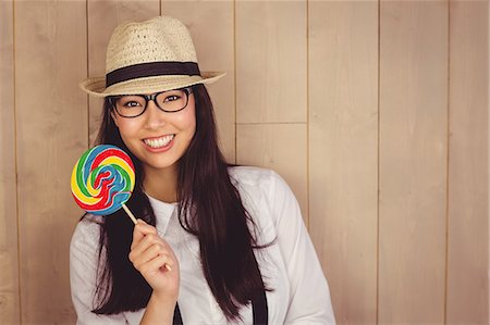 simsearch:6109-08398339,k - Pretty hipster with hat and lollipop Stock Photo - Premium Royalty-Free, Code: 6109-08398328