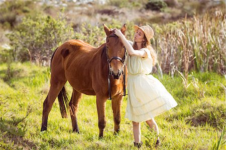 simsearch:6109-08398485,k - Young happy woman with her horse Foto de stock - Sin royalties Premium, Código: 6109-08398444