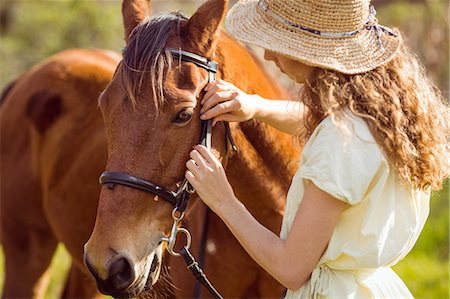 simsearch:6109-08399497,k - Young happy woman with her horse Foto de stock - Sin royalties Premium, Código: 6109-08398446