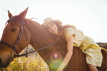 simsearch:6109-08398485,k - Young happy woman riding her horse Foto de stock - Sin royalties Premium, Código: 6109-08398454