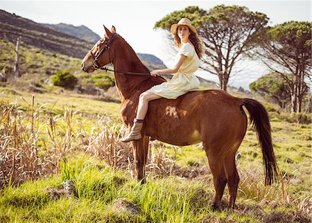 simsearch:6109-08398485,k - Young happy woman riding her horse Foto de stock - Sin royalties Premium, Código: 6109-08398455