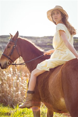 simsearch:6109-08398485,k - Young happy woman riding her horse Foto de stock - Sin royalties Premium, Código: 6109-08398459