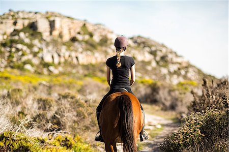 simsearch:6109-08398485,k - Young woman riding her horse Foto de stock - Sin royalties Premium, Código: 6109-08398470