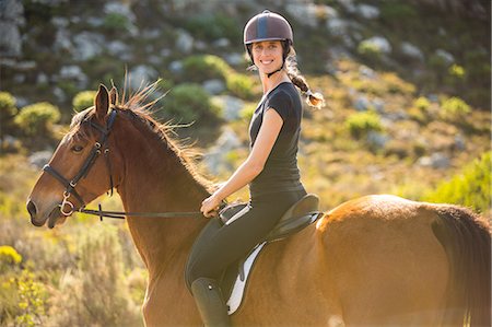 simsearch:6109-08398485,k - Young woman riding her horse Foto de stock - Sin royalties Premium, Código: 6109-08398479