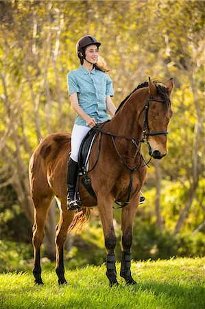 simsearch:6109-08398485,k - Young woman riding her horse Foto de stock - Sin royalties Premium, Código: 6109-08398494