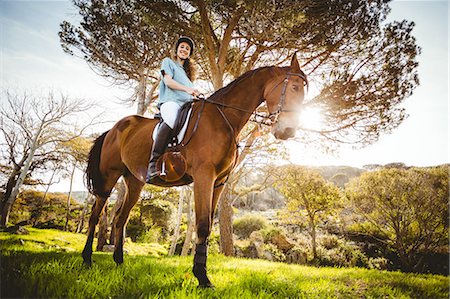 simsearch:6109-08398485,k - Young woman riding her horse Foto de stock - Sin royalties Premium, Código: 6109-08398505