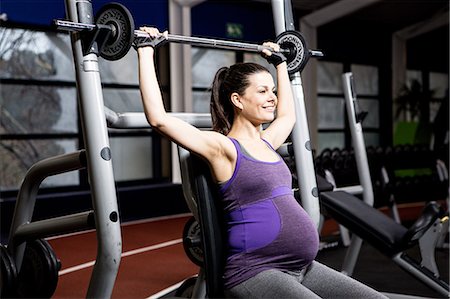 pregnant exercising - Pregnant woman working out with weights Stock Photo - Premium Royalty-Free, Code: 6109-08398747