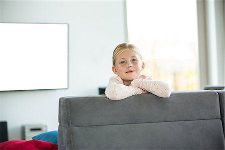 Cute girl looking at camera Stock Photo - Premium Royalty-Free, Code: 6109-08398867