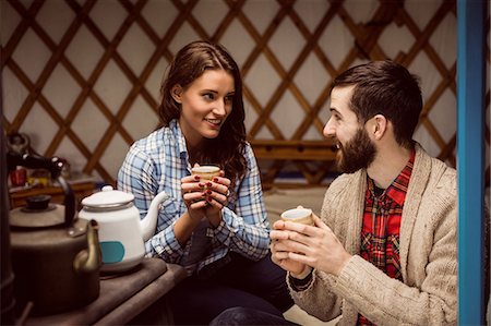 simsearch:6109-08399054,k - Couple talking and drinking tea Stock Photo - Premium Royalty-Free, Code: 6109-08399050