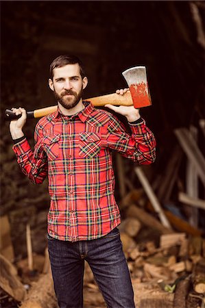 simsearch:6109-08399054,k - Smiling man with axe Stock Photo - Premium Royalty-Free, Code: 6109-08399055