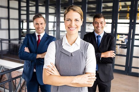 portrait of happy mature businessman standing arms crossed in office - Portrait of smiling business people Stock Photo - Premium Royalty-Free, Code: 6109-08399198