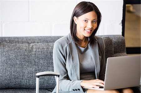 Businesswoman using laptop Stock Photo - Premium Royalty-Free, Code: 6109-08399116