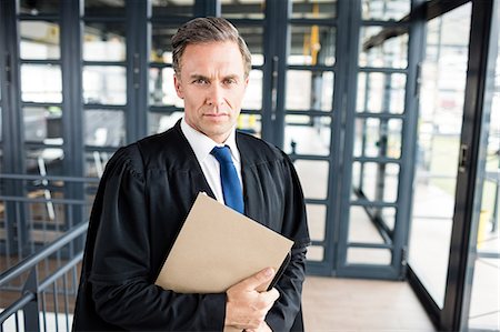 simsearch:6109-07601594,k - Serious lawyer looking at the camera Stock Photo - Premium Royalty-Free, Code: 6109-08399269