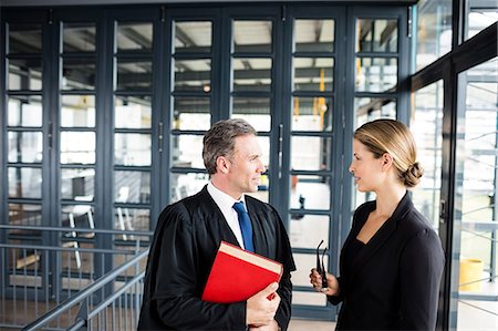 female office workers talking in the hallway - Business people talking to each other Stock Photo - Premium Royalty-Free, Code: 6109-08399273