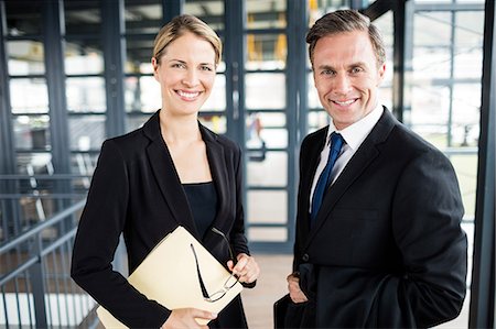 simsearch:6109-08399289,k - Two smiling Business people meeting Stock Photo - Premium Royalty-Free, Code: 6109-08399276