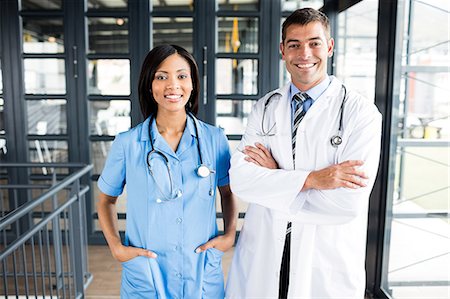 simsearch:6109-08399289,k - Nurse and doctor smiling Stock Photo - Premium Royalty-Free, Code: 6109-08399291