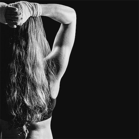 female boxers bodies - Composite image of rear view of female boxer with long brown hair Photographie de stock - Premium Libres de Droits, Code: 6109-08399446