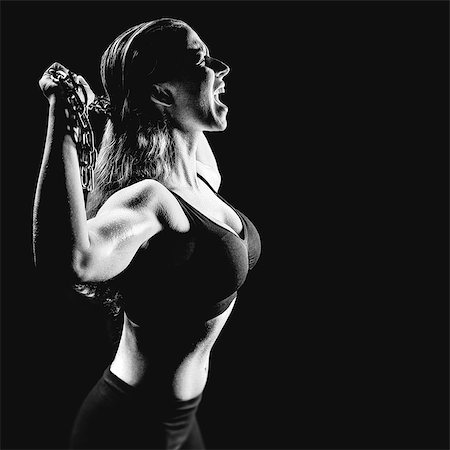 fit (tight clothes) - Composite image of side view of angry athlete shouting while holding chain Stock Photo - Premium Royalty-Free, Code: 6109-08399449