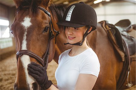 simsearch:6109-08399536,k - Female rider leading her horse Stock Photo - Premium Royalty-Free, Code: 6109-08399468