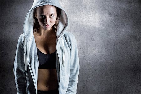 sportler (männlich und weiblich) - Composite image of portrait of female athlete in hood Stockbilder - Premium RF Lizenzfrei, Bildnummer: 6109-08399430