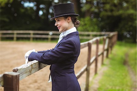 Smiling jockey posing for camera Stock Photo - Premium Royalty-Free, Code: 6109-08399534