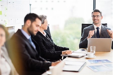 simsearch:6109-08488776,k - Business team having a meeting at the office Stock Photo - Premium Royalty-Free, Code: 6109-08488764