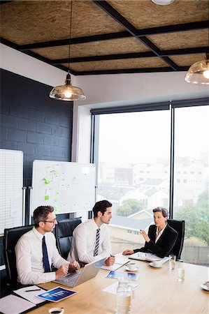 simsearch:6109-08488781,k - Business team having a meeting at the office Stock Photo - Premium Royalty-Free, Code: 6109-08488769