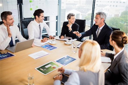 Business team having a meeting at the office Stock Photo - Premium Royalty-Free, Code: 6109-08488771