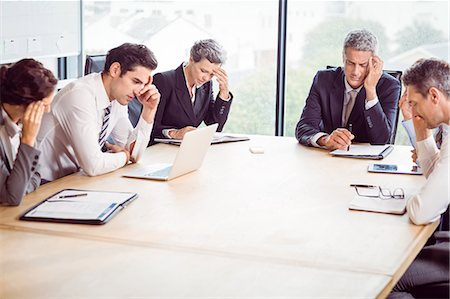 sad 50 year old men - Business team hungover at meeting at the office Foto de stock - Sin royalties Premium, Código: 6109-08488786