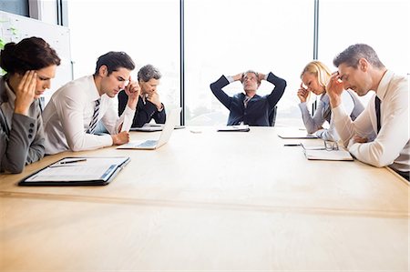 sad 50 year old men - Business team hungover at meeting at the office Foto de stock - Sin royalties Premium, Código: 6109-08488788