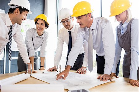 simsearch:6109-06781524,k - Architecture team working together at desk at the office Stock Photo - Premium Royalty-Free, Code: 6109-08488797