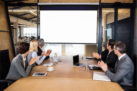 simsearch:6109-08488776,k - Business team using video chat during meeting at the office Stock Photo - Premium Royalty-Free, Code: 6109-08488795