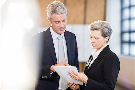 simsearch:6109-08488704,k - Business team standing and speaking at the office Stock Photo - Premium Royalty-Free, Code: 6109-08488717