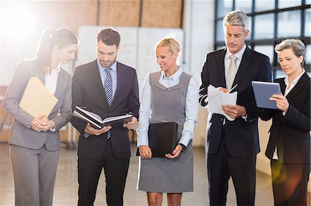 simsearch:6109-06781334,k - Business team standing and speaking at the office Stock Photo - Premium Royalty-Free, Code: 6109-08488719