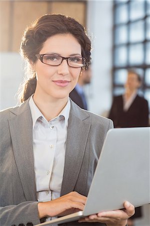 simsearch:400-05663929,k - Businesswoman using her laptop at the office Stock Photo - Premium Royalty-Free, Code: 6109-08488735