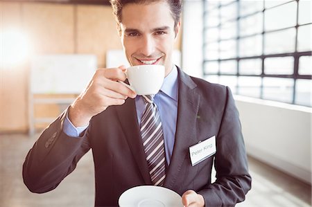 Businessman smiling at conference at the office Stock Photo - Premium Royalty-Free, Code: 6109-08488853